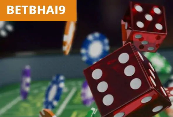 Red dice and casino chips with "BETBHAI9" text on green background for online betting.
